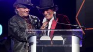 Johnny Depp presents Joe Perry with The Les Paul Award (Photo by Jesse Grant/Getty Images for NAMM)
