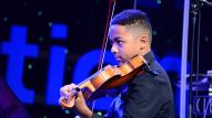 A member of The Perfect Fourth Quartet performs at The Grand Rally for Music Education